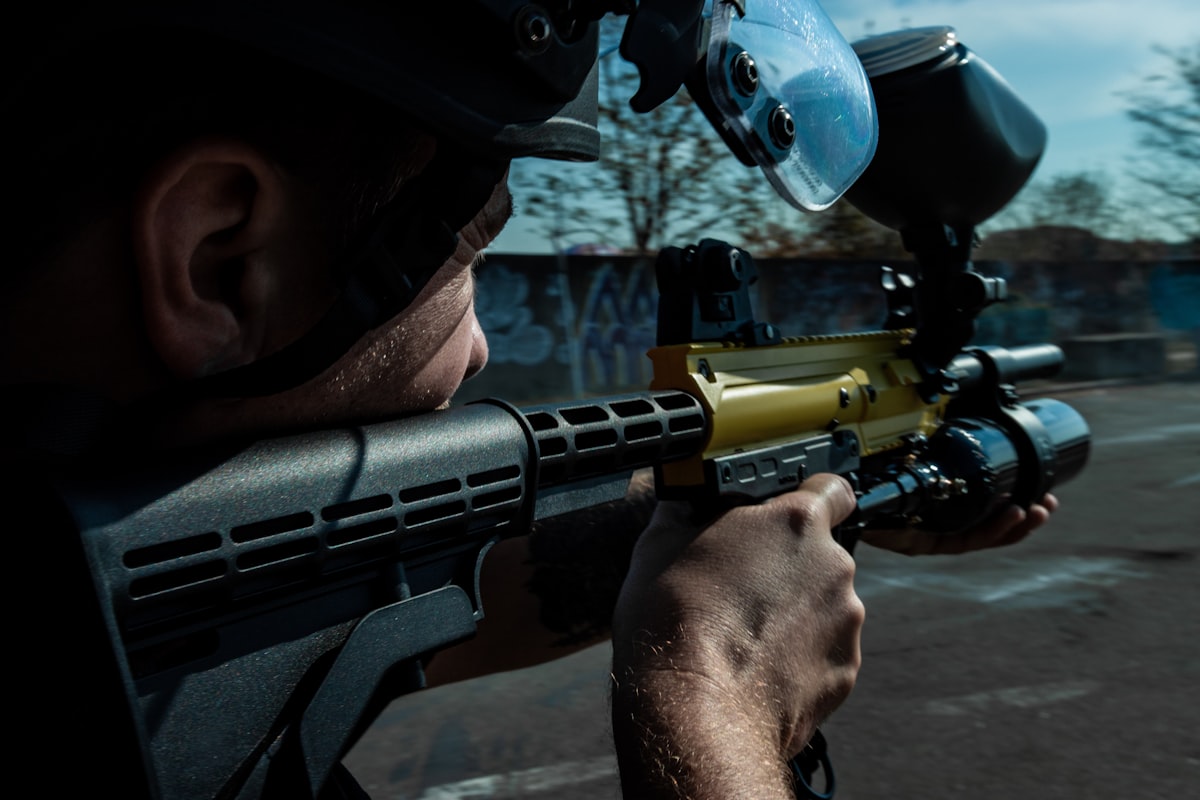 paintball cleats and hiking boots side by side for field comparison